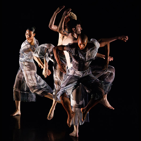Trisha Brown Dance Company dancers on stage in movement