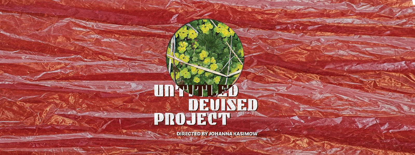 Red wrinkled plastic with a circle cut out revealing green clovers
