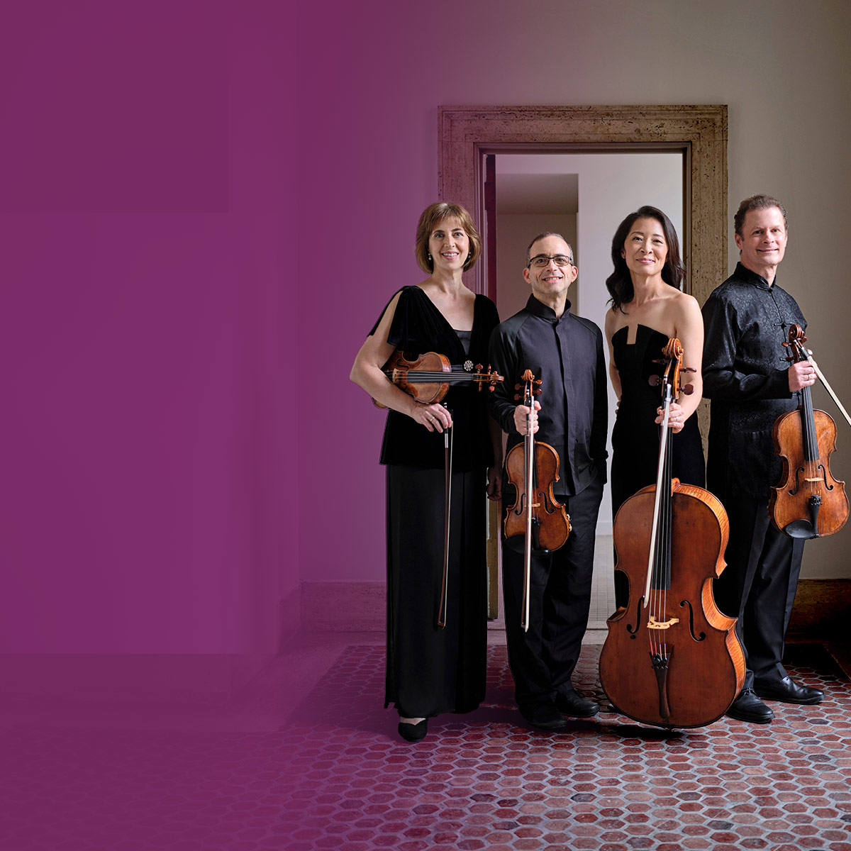 Brentano String Quartet posing with their instruments