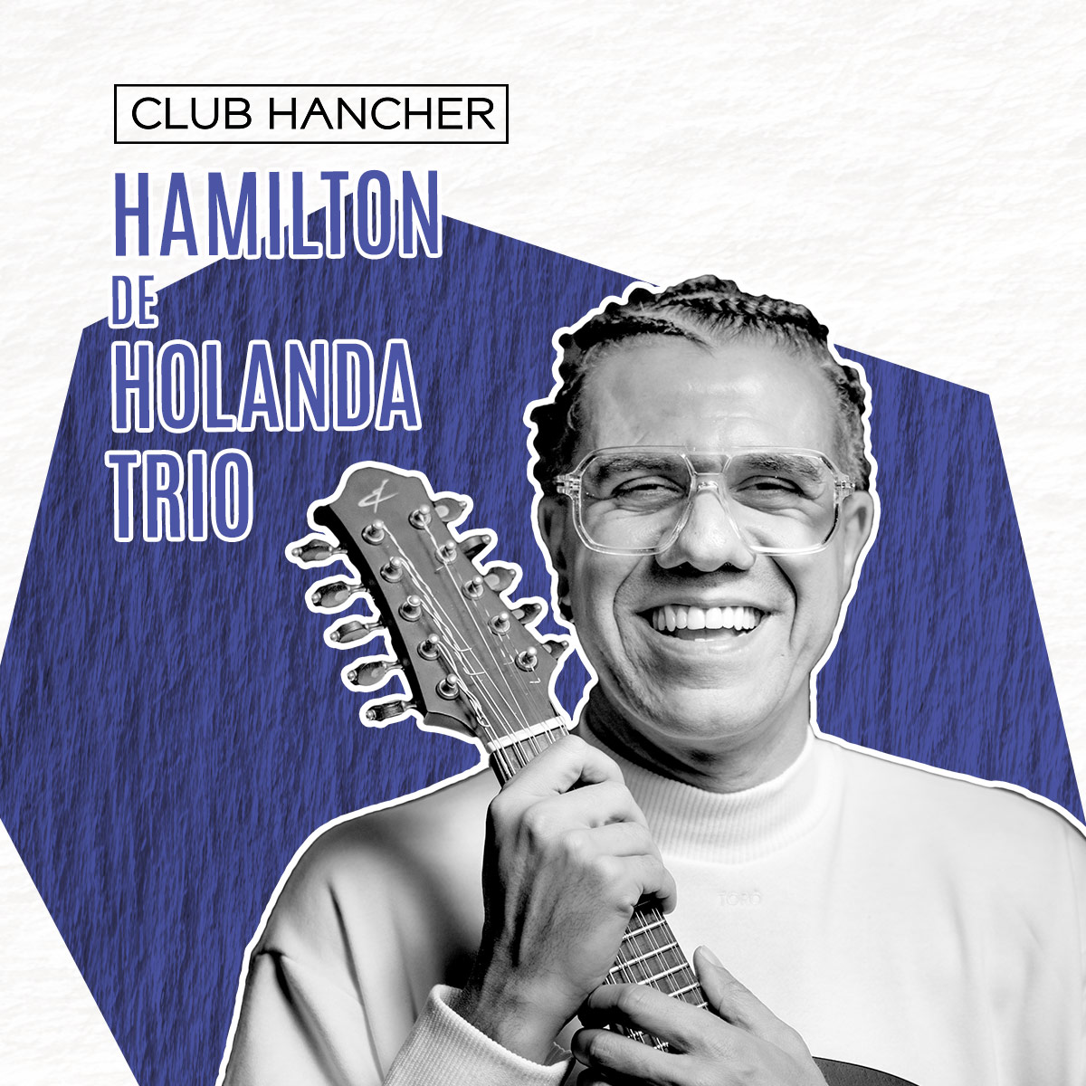 Black and white portrait of Hamilton de Holanda smiling while holding a bandolin
