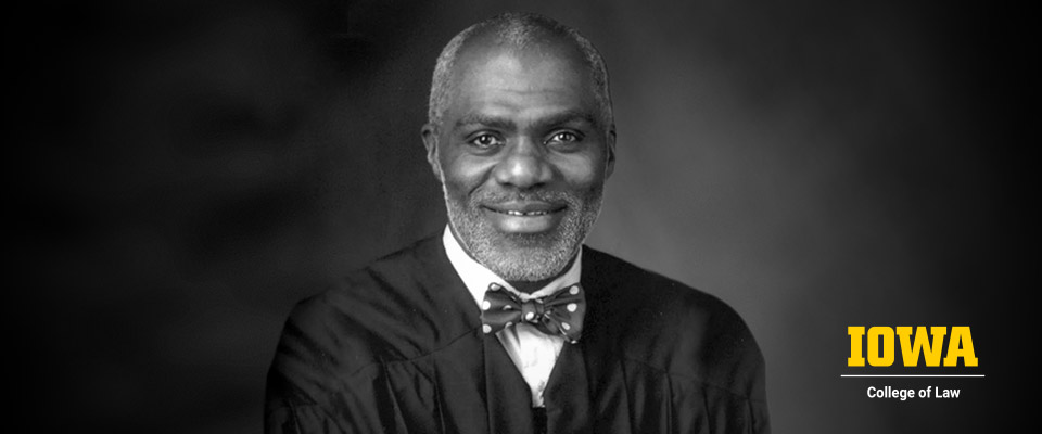 Alan Page black and white headshot with Iowa logo in right lower corner