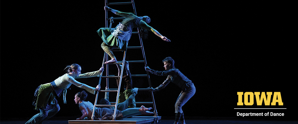 Department of Dance members performing a work on stage climbing a ladder