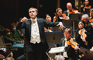 Royal Philharmonic Orchestra music director, Vasily Petrenko, conducting musicians 