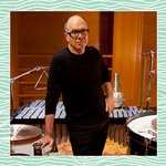Steven Schick standing in front of percussion instruments