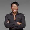 Photo of Joy Reid from waist up arms crossed wearing a black button down shirt