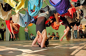 Trisha Brown Dance Company: FLOOR OF THE FOREST Trisha Brown Dance Company dancers hanging from fabric connected to the ceiling