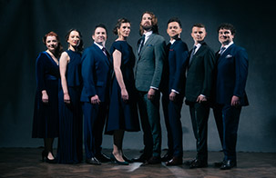 VOCES8 VOCES8 singers standing in a v formation