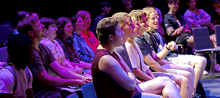 Students seated in front of a Hancher performance