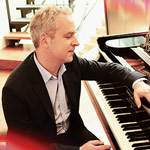 Jeremy Denk, piano Jeremy Denk: Colored photo of Jeremy Denk sitting at a piano
