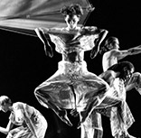 Trisha Brown Dance Company dancers in movement. Photo is in black and white