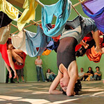 Trisha Brown Dance Company: FLOOR OF THE FOREST Trisha Brown Dance Company dancers hanging from fabric connected to the ceiling